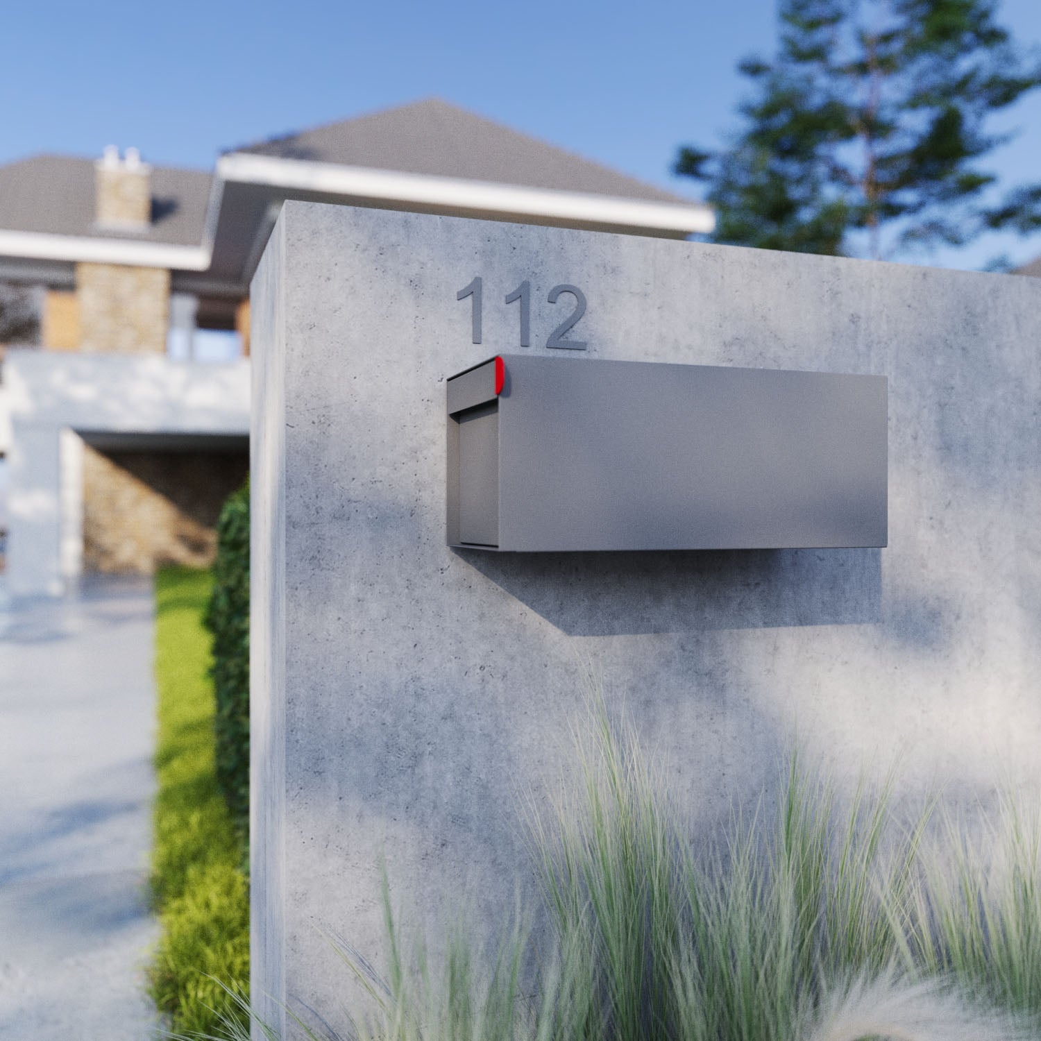 Post mount mailbox TOWN SQUARE in Gray attached to a modern home with clean landscaping and visible house number.
